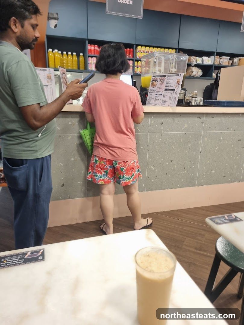 Counter with customers and menu