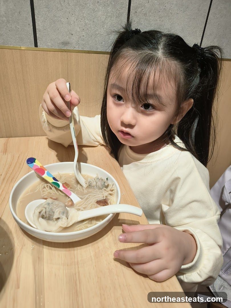 Child Eating Noodles