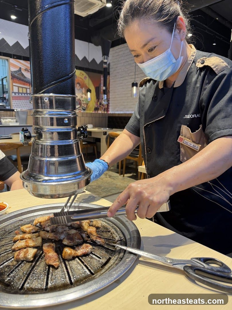 Staff grilling meat