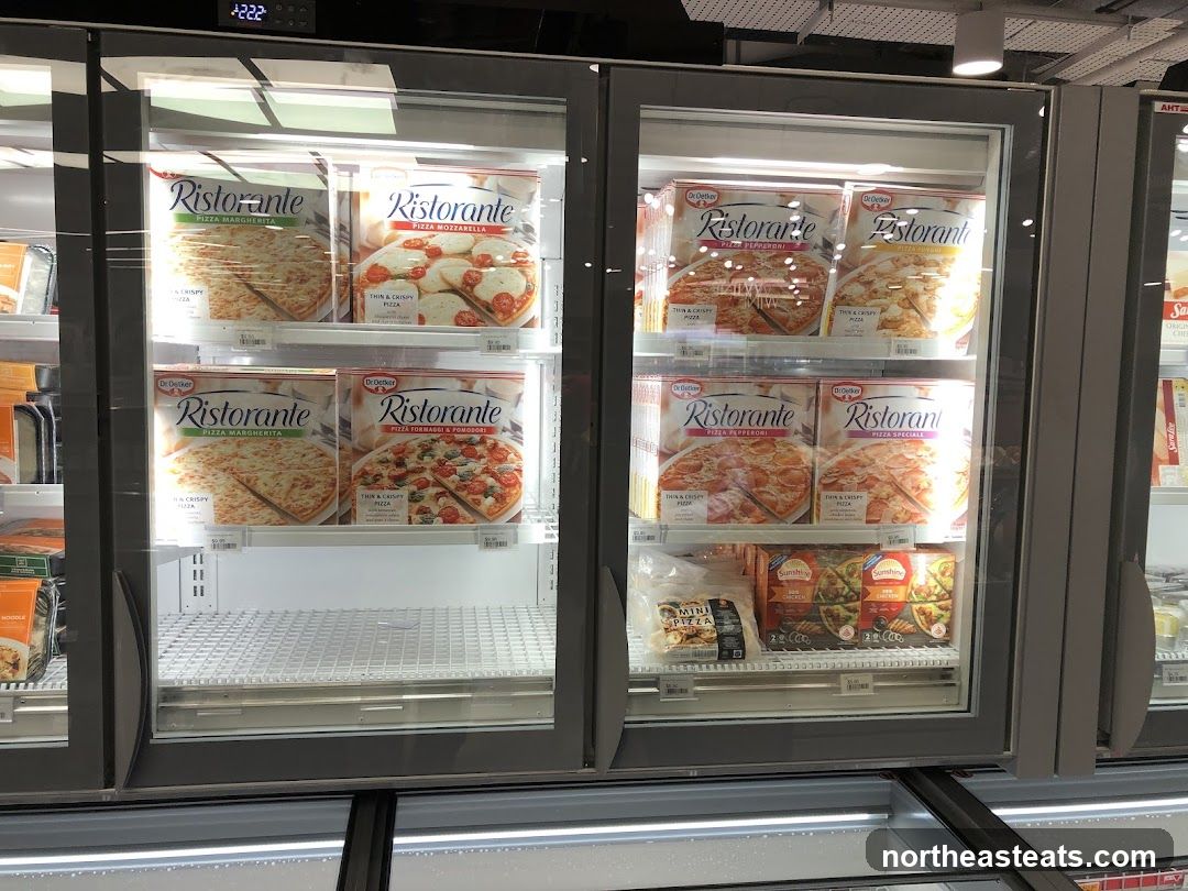 Frozen Pizzas in a Freezer Display