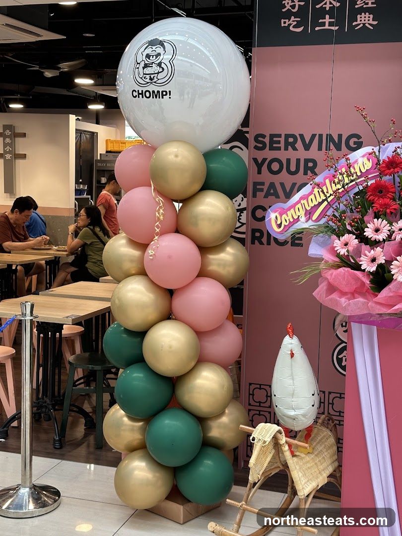 Celebratory Balloons and Floral Arrangement
