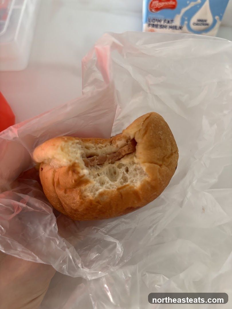Bite taken out of a filled bun