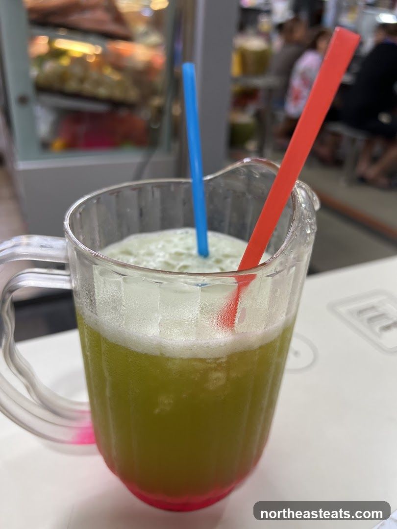 Pitcher of Green Juice with Straws
