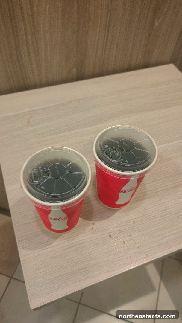Two Coca-Cola Cups