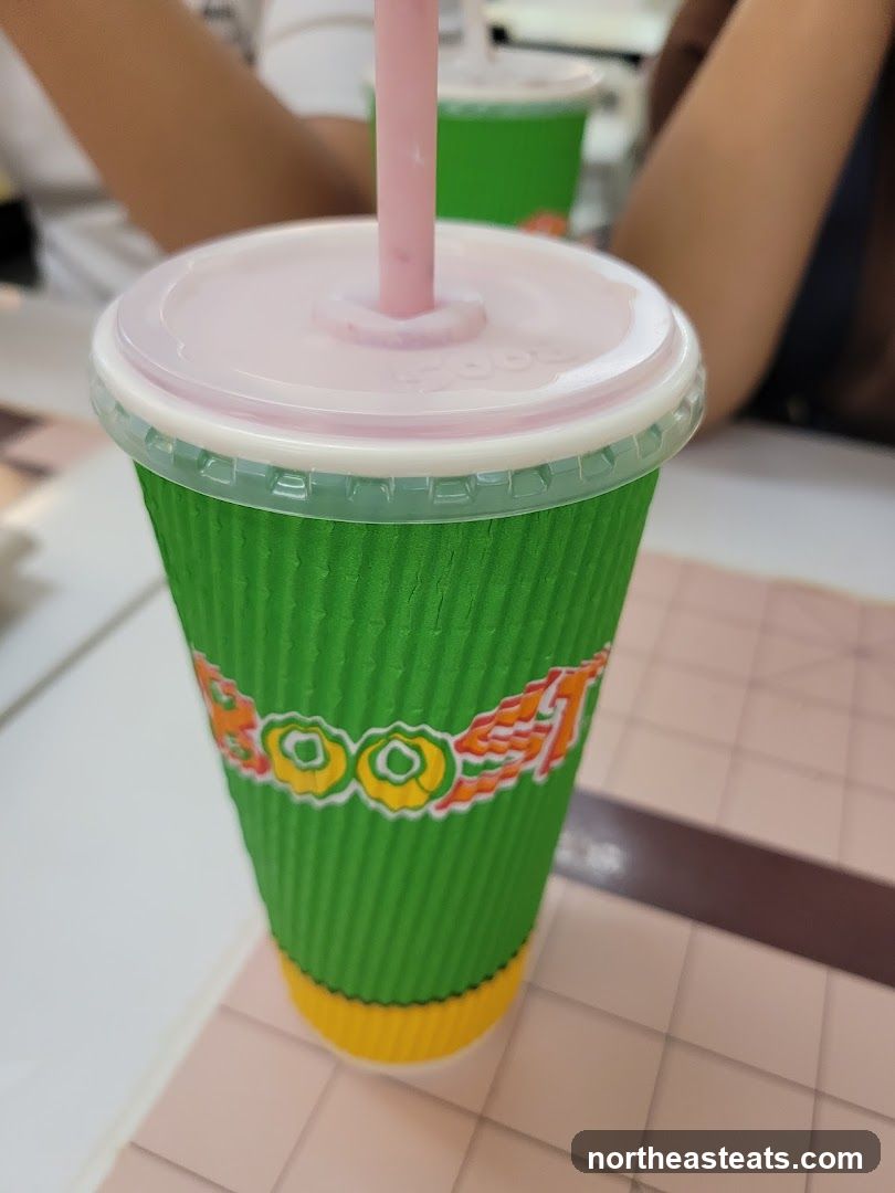 Green cup with pink straw