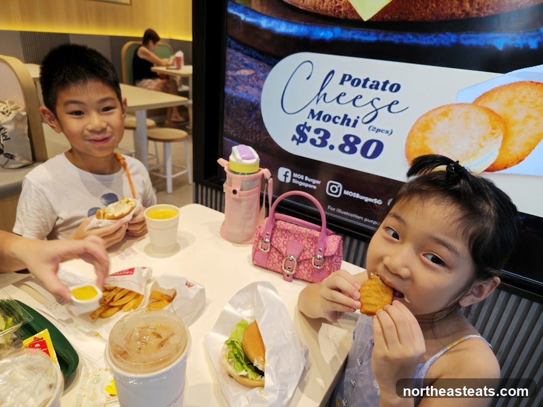 Children enjoying food at MOS Burger