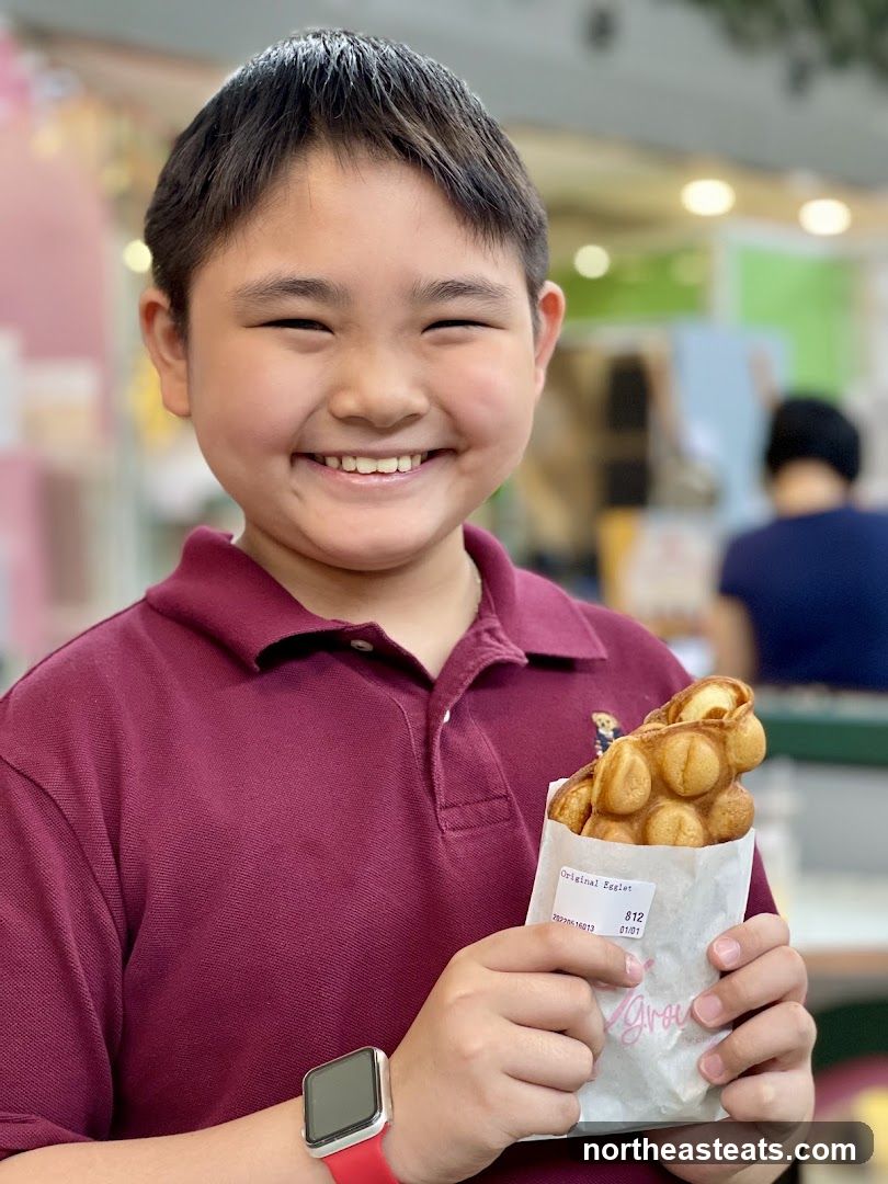 Boy holding bubble waffle