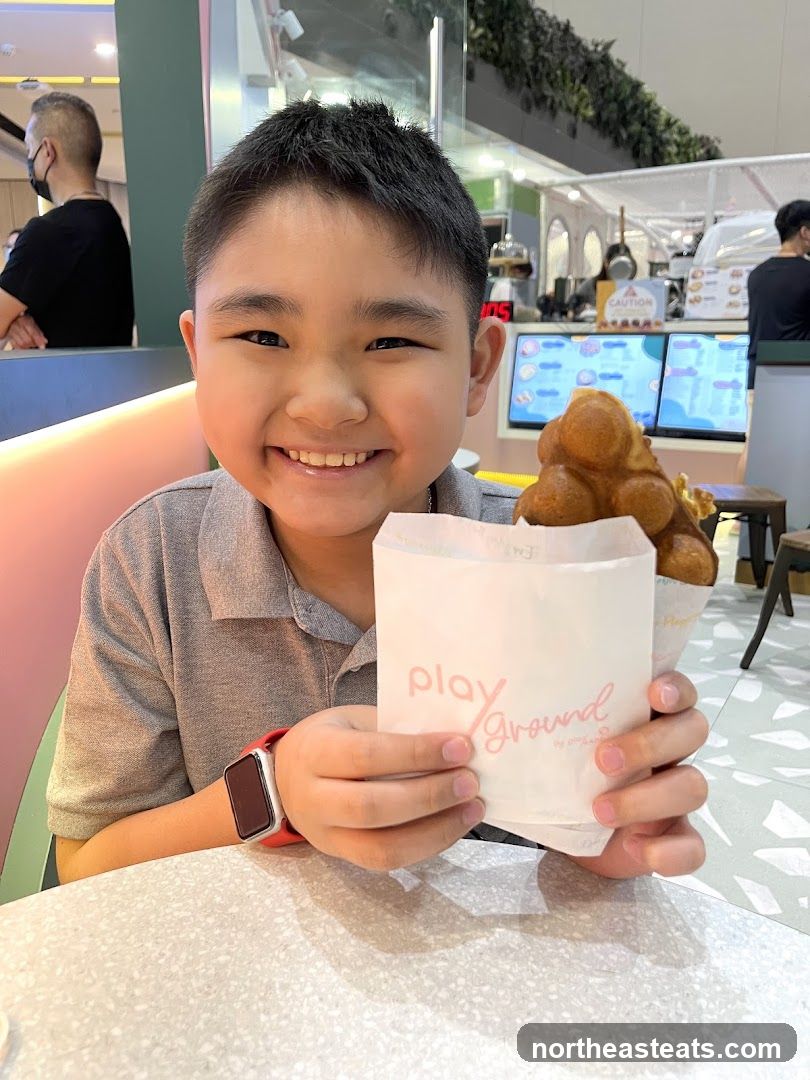 Boy holding bubble waffle