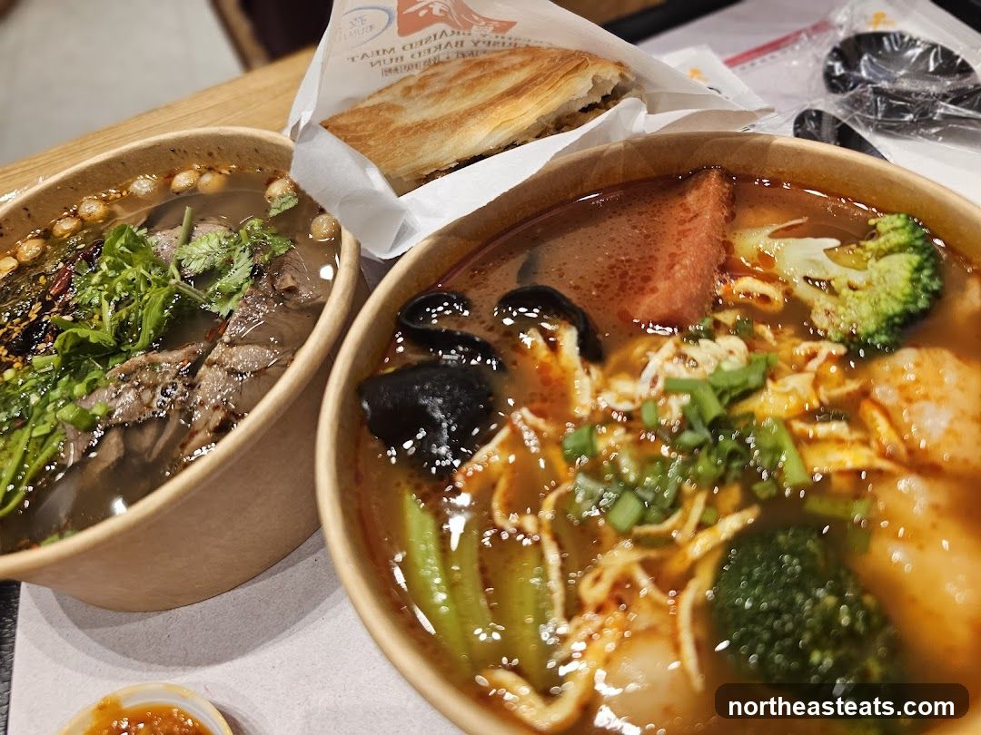 Two bowls of soup with a pastry