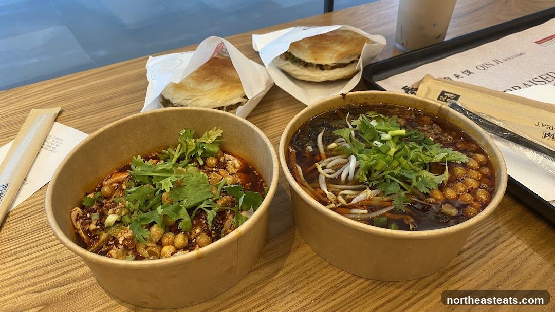 Two Bowls of Noodles and Two Burgers