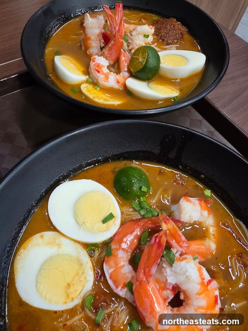 Two bowls of prawn noodle soup