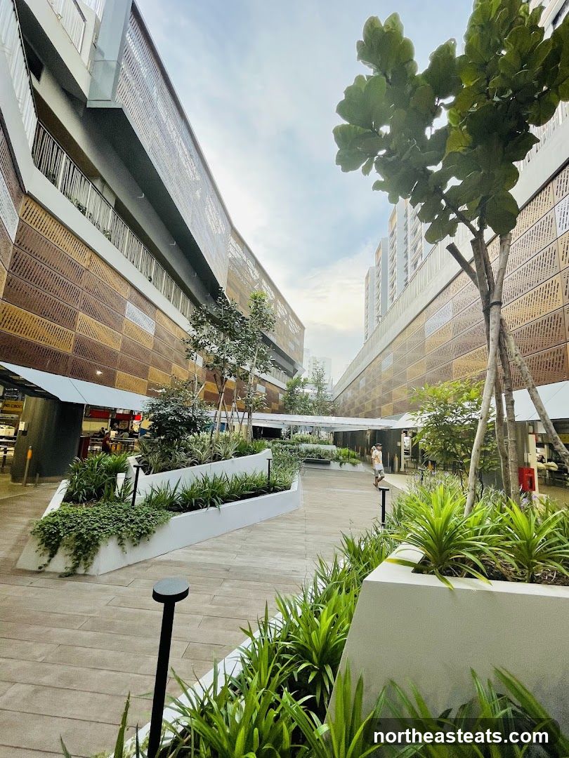 Outdoor walkway with modern architecture and landscaping