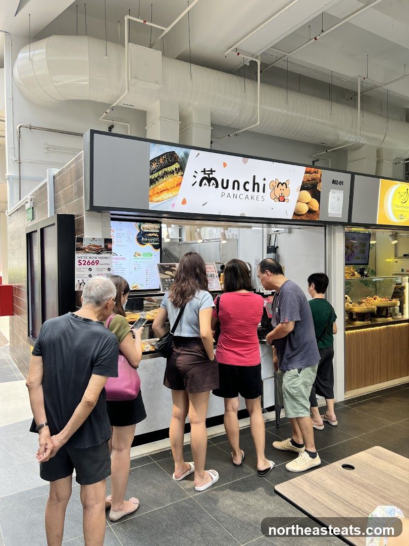 People queuing at a pancake stall