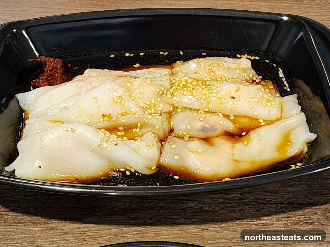 Steamed Rice Rolls with Sauce and Sesame Seeds