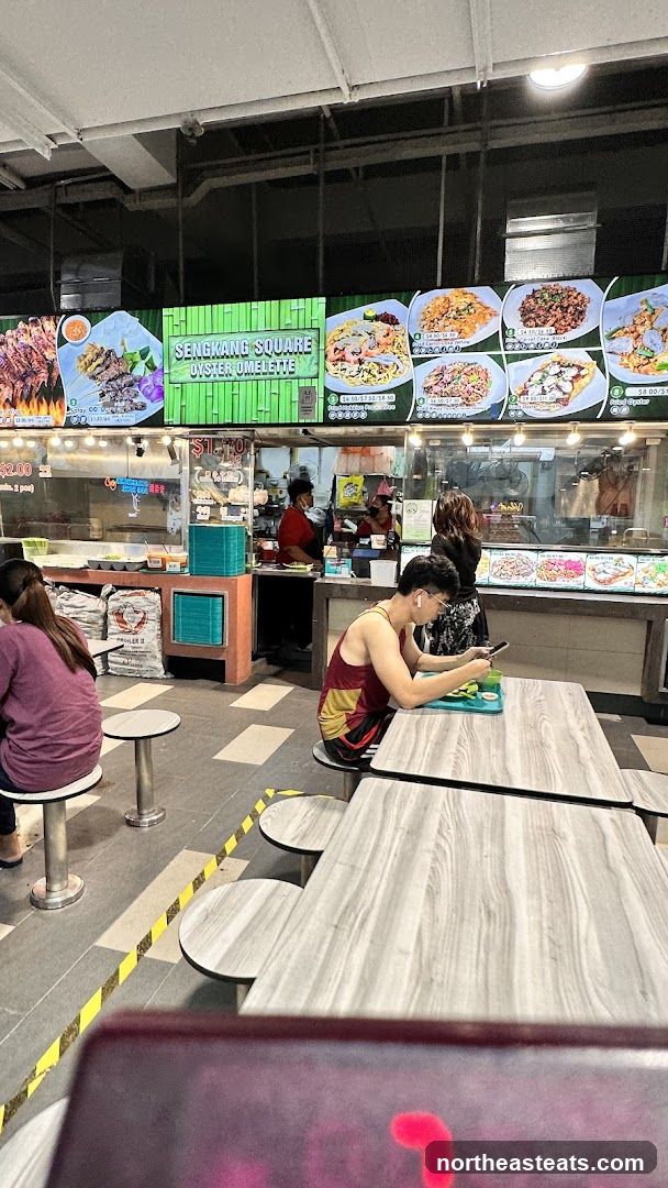 Food court stalls with displayed menus