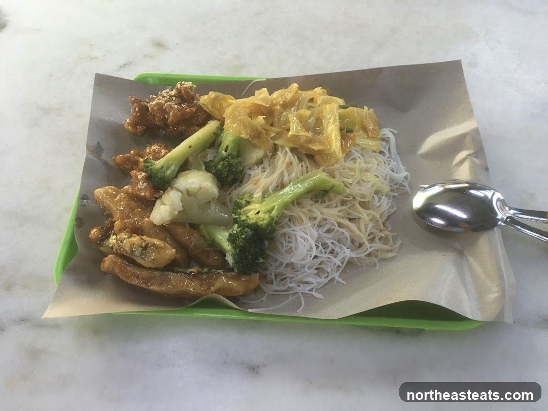 Rice noodles with stir-fried vegetables and protein
