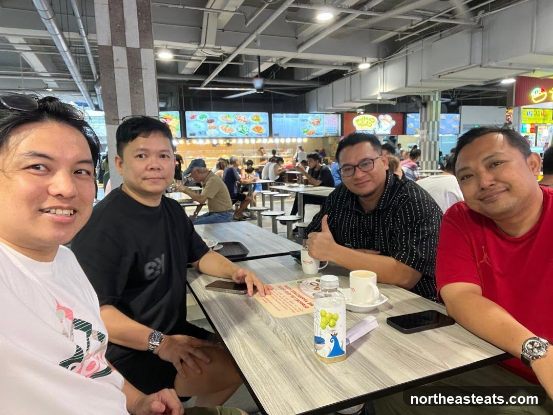 Four men at a food court