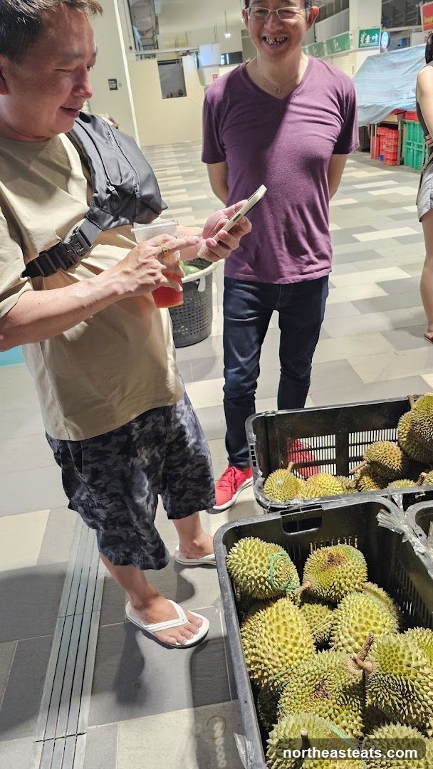 People looking at durians