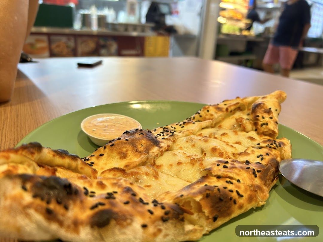 Cheese-filled flatbread with dipping sauce