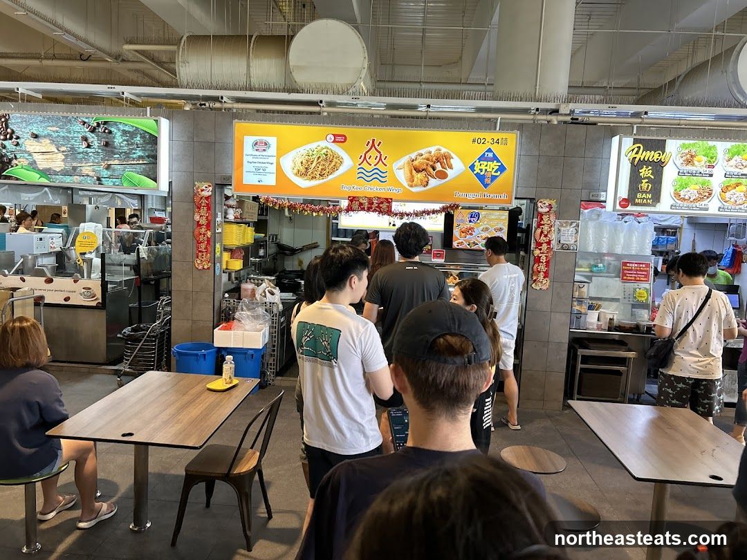 Food court with various stalls and diners