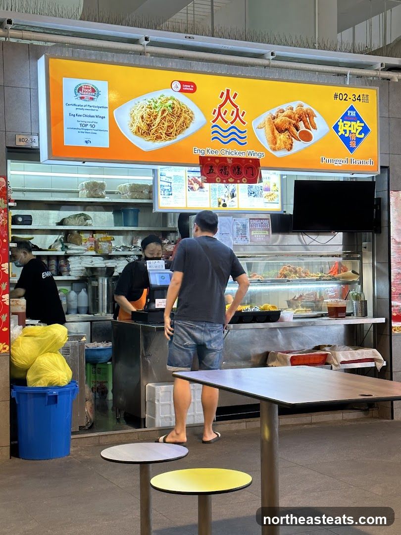 Food Stall with Chicken Wings and Noodles