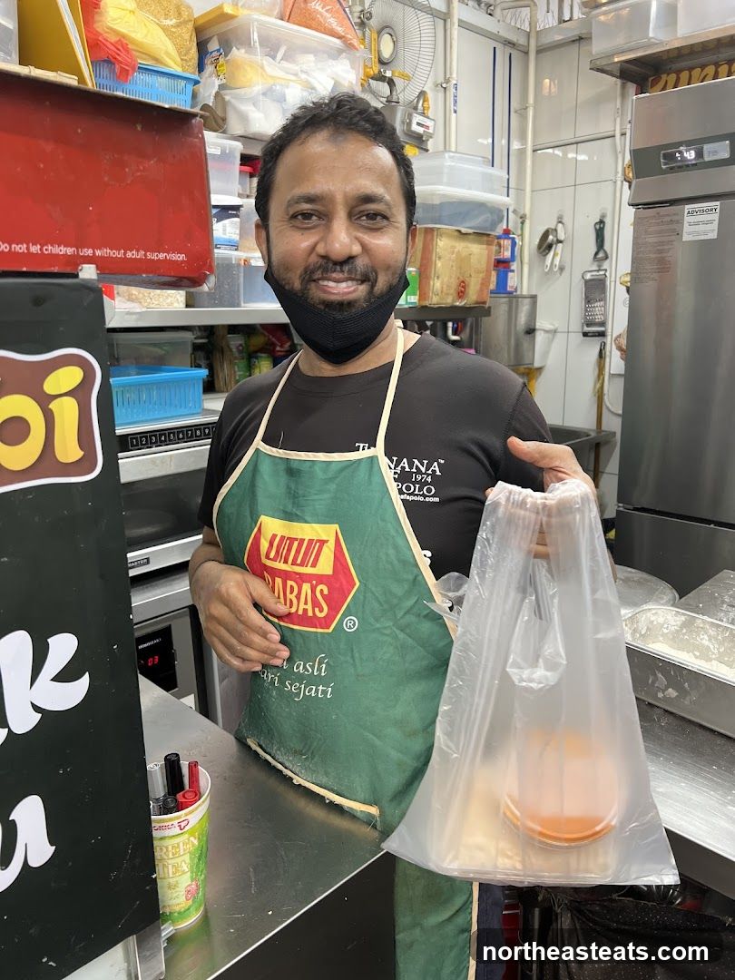 Man holding a takeout bag