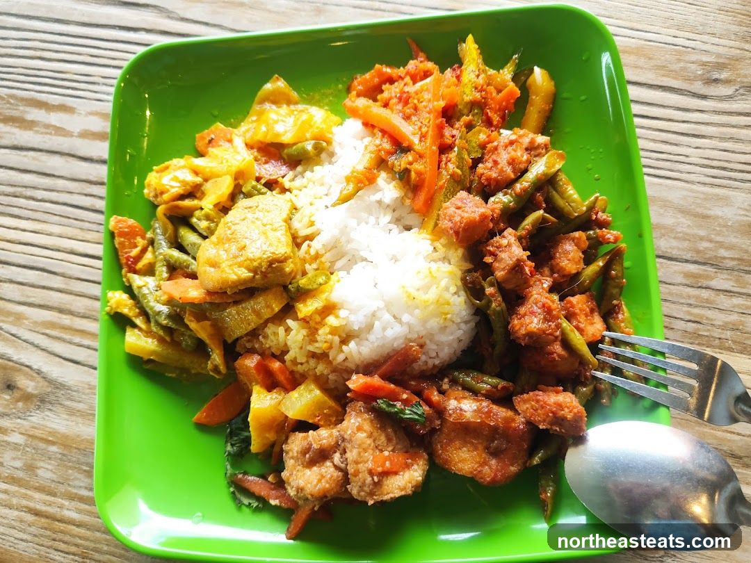 Plate of rice with various side dishes
