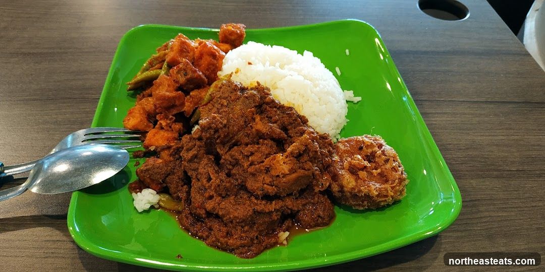 Plate of food with rice and meat