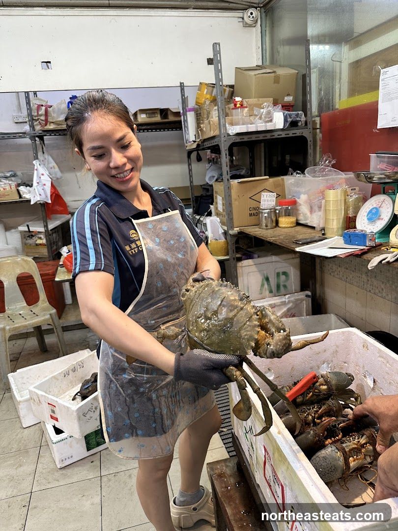 Woman holding a large crab