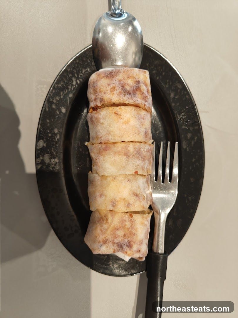 Rolled Food Item on Plate