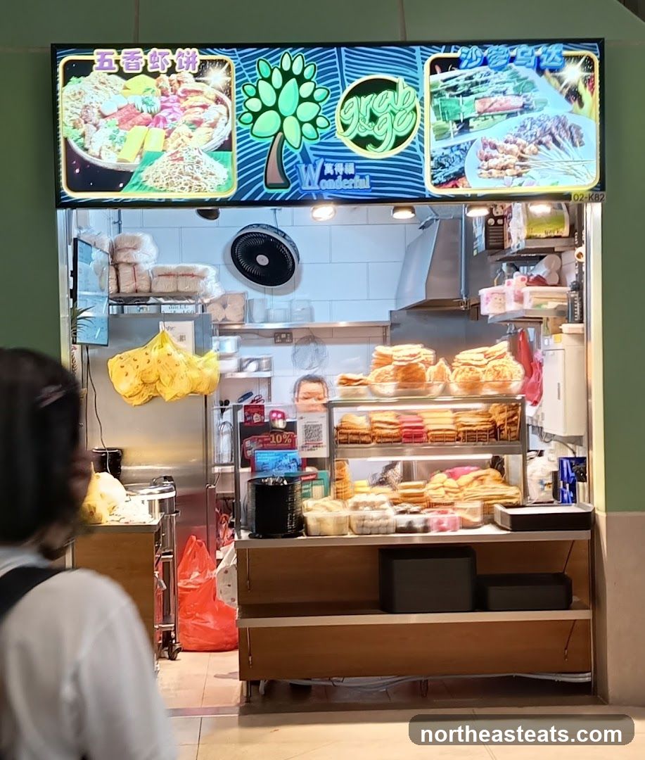 Food stall with various snacks and skewers