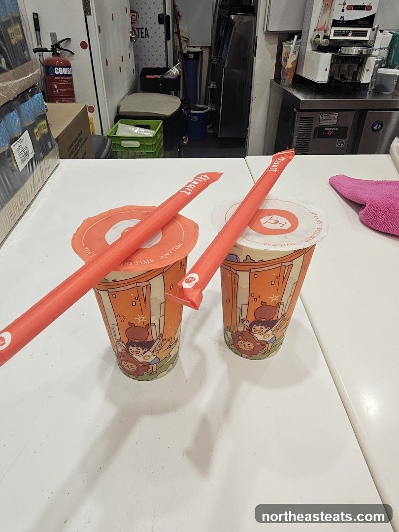 Two bubble tea drinks with straws