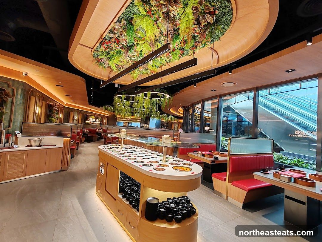 Restaurant Interior with Greenery and Booth Seating