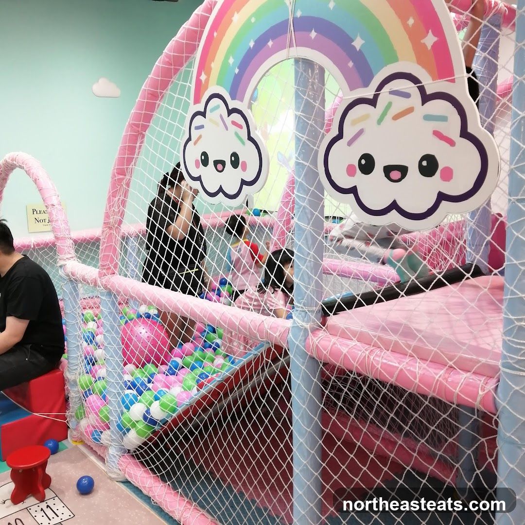 Indoor Playground with Rainbow and Cloud Decorations