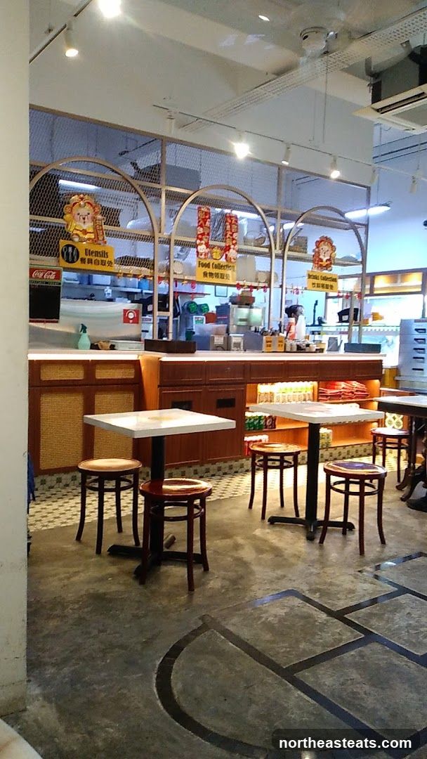 Restaurant Interior with Seating and Food Collection Area