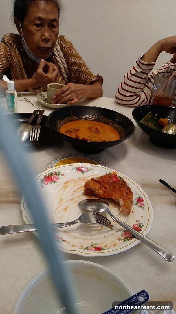Diners at a table with leftover food