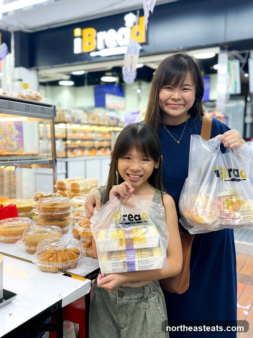 Two girls holding bags of baked goods