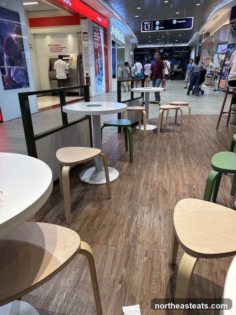 Indoor seating area with tables and chairs