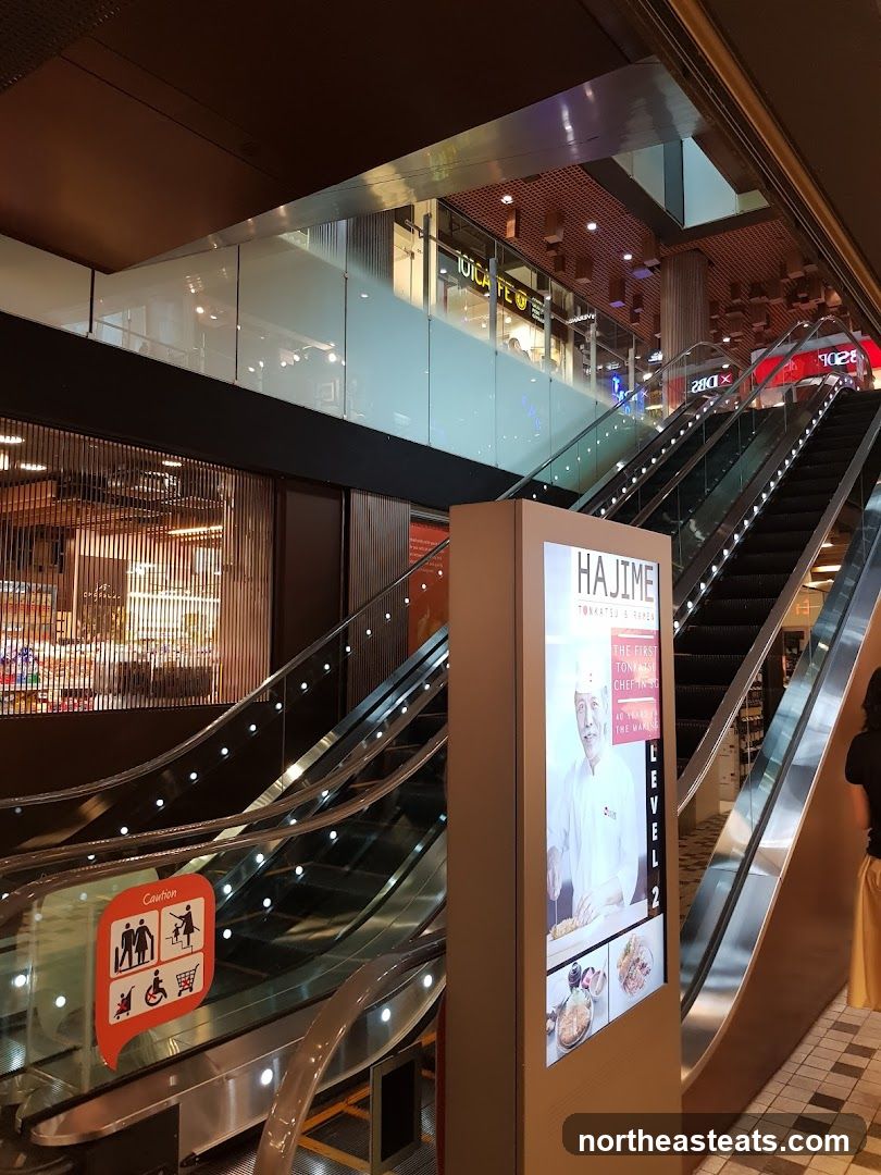 Escalators and Restaurant Advertisement