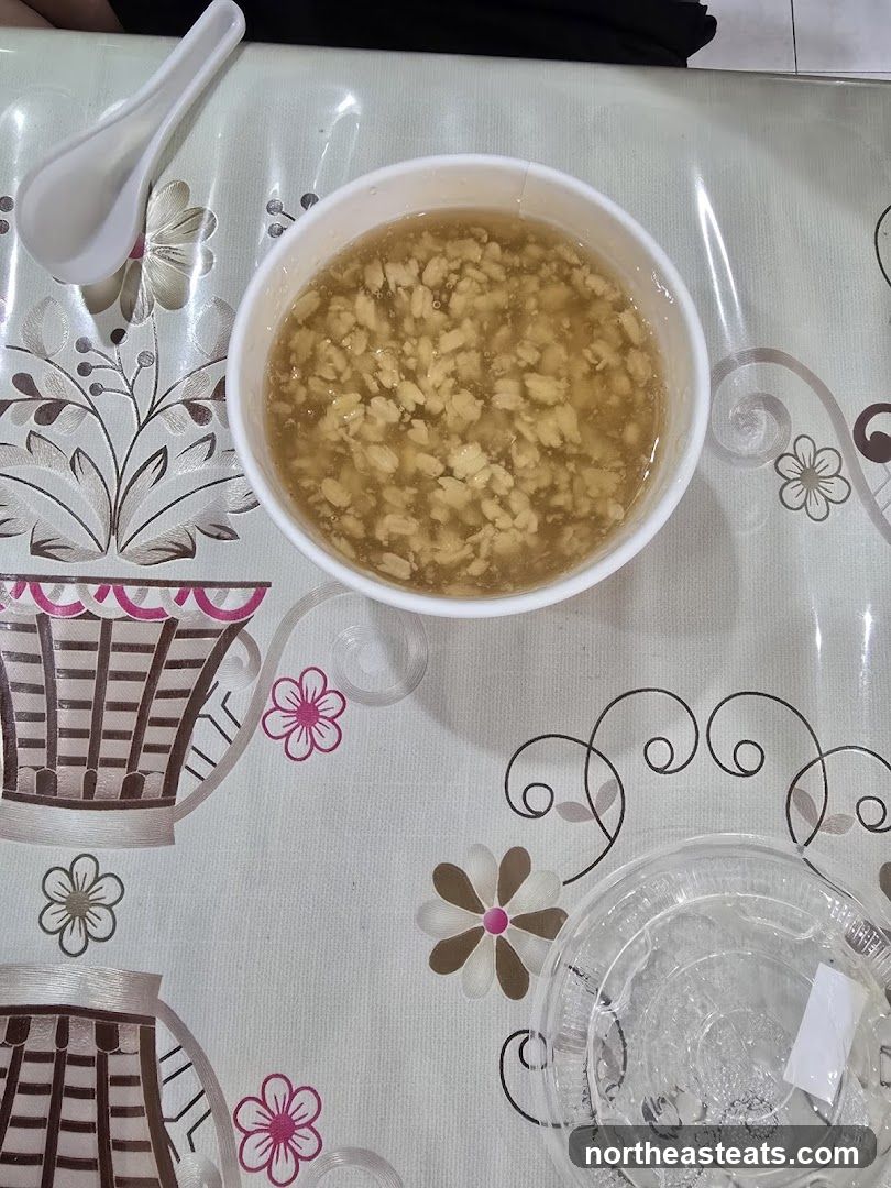 Bowl of food with spoon and drink