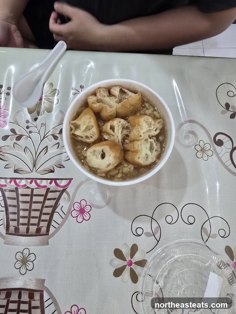 Bowl of food with fried dough
