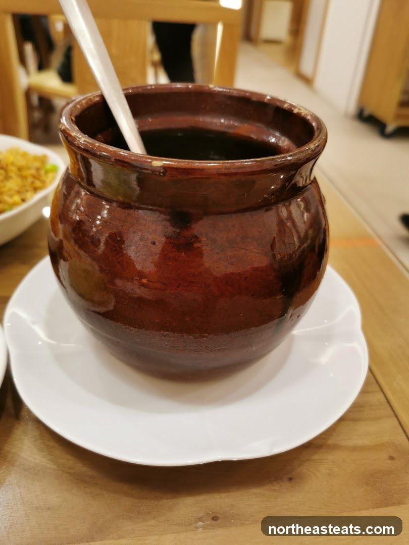 Brown Ceramic Pot with Spoon