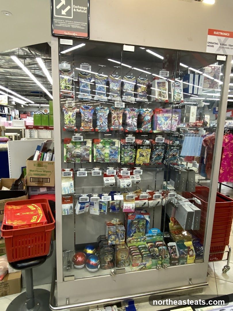 Display case with trading cards and electronics accessories