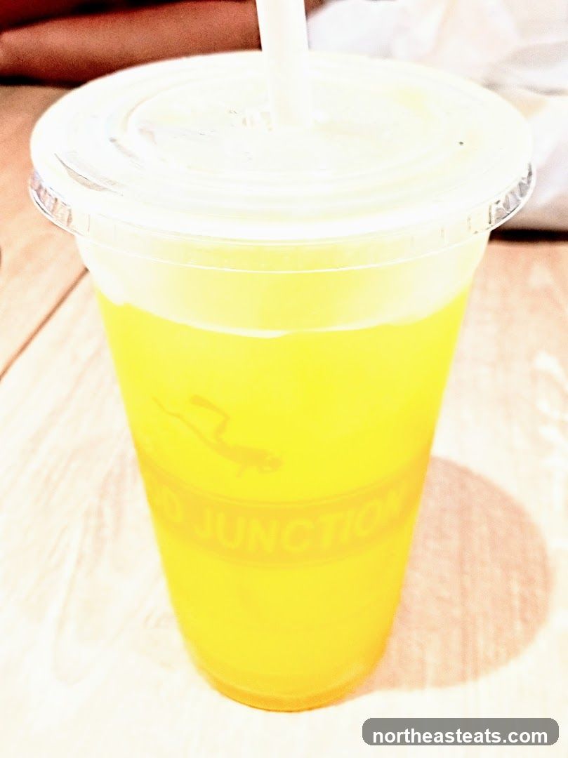 Yellow Drink in a Plastic Cup