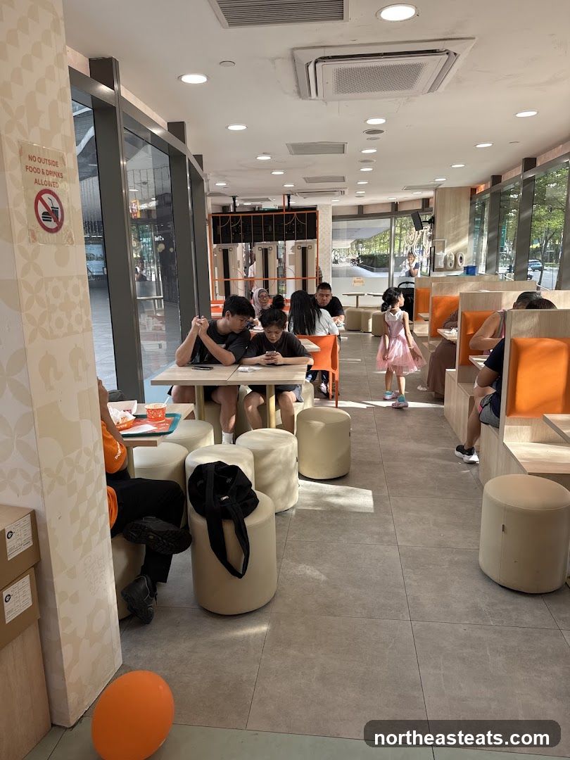 Diners in a brightly lit fast-food restaurant