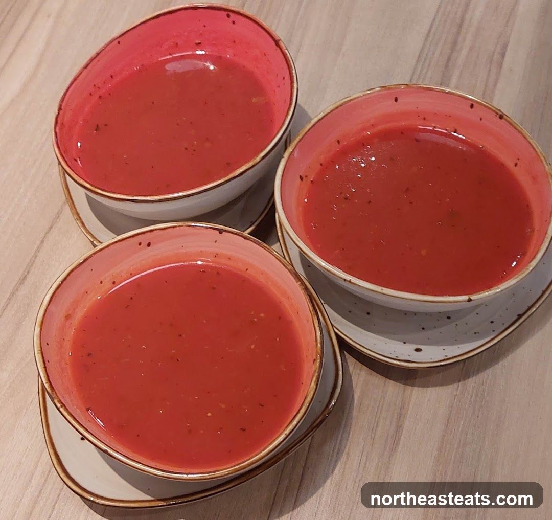 Three bowls of tomato soup