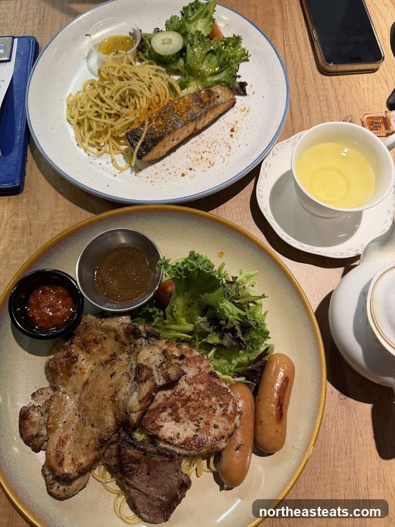 Two plates of food with a cup of tea
