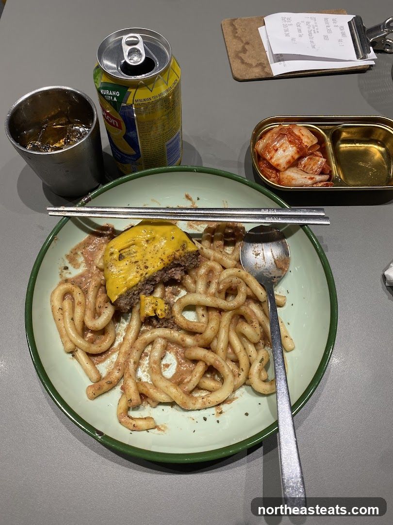 Meal with Noodles and Burger Patty