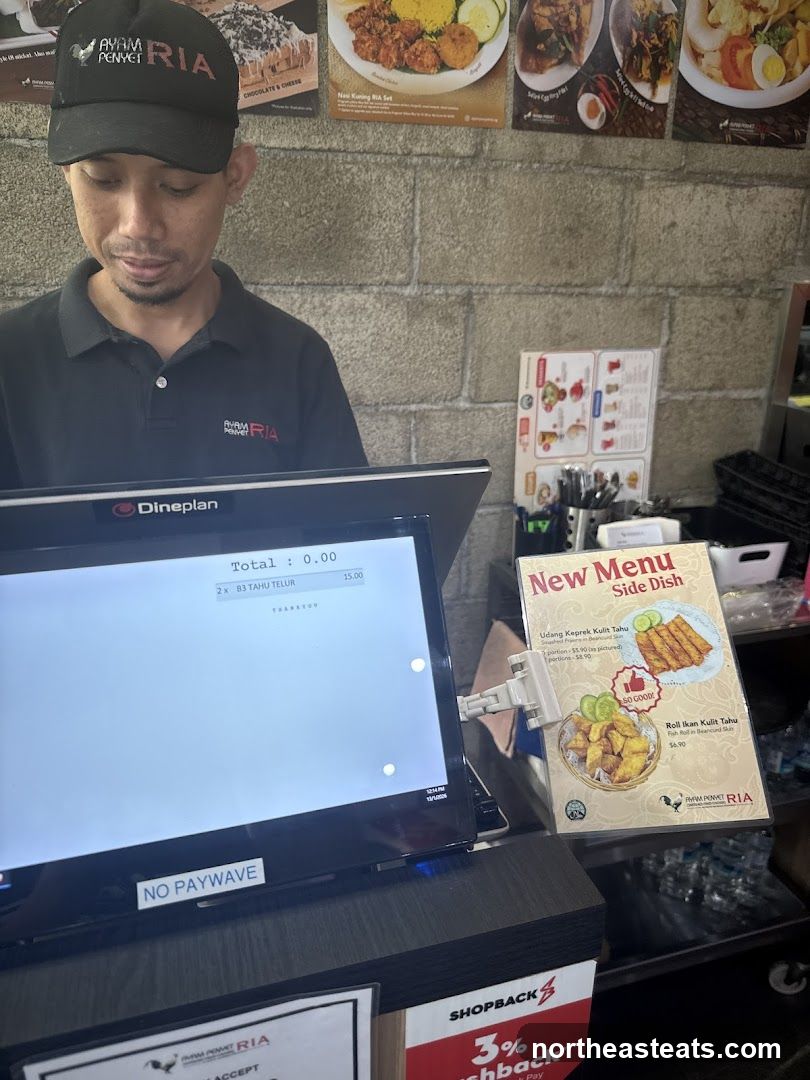 Cashier with POS system and menu