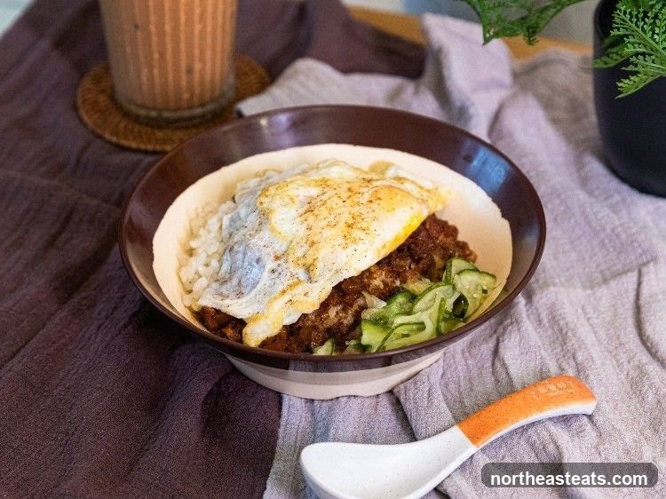 Rice bowl with fried egg and minced meat